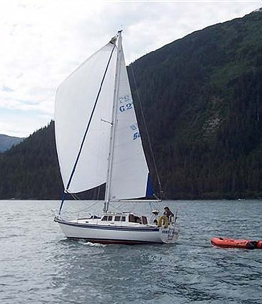 Sloop below the mountains