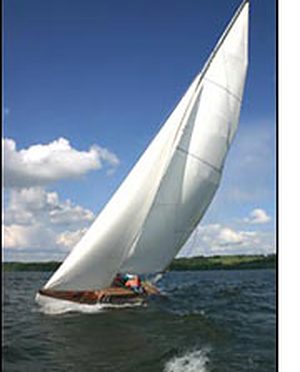 White sail heeling in the breeze